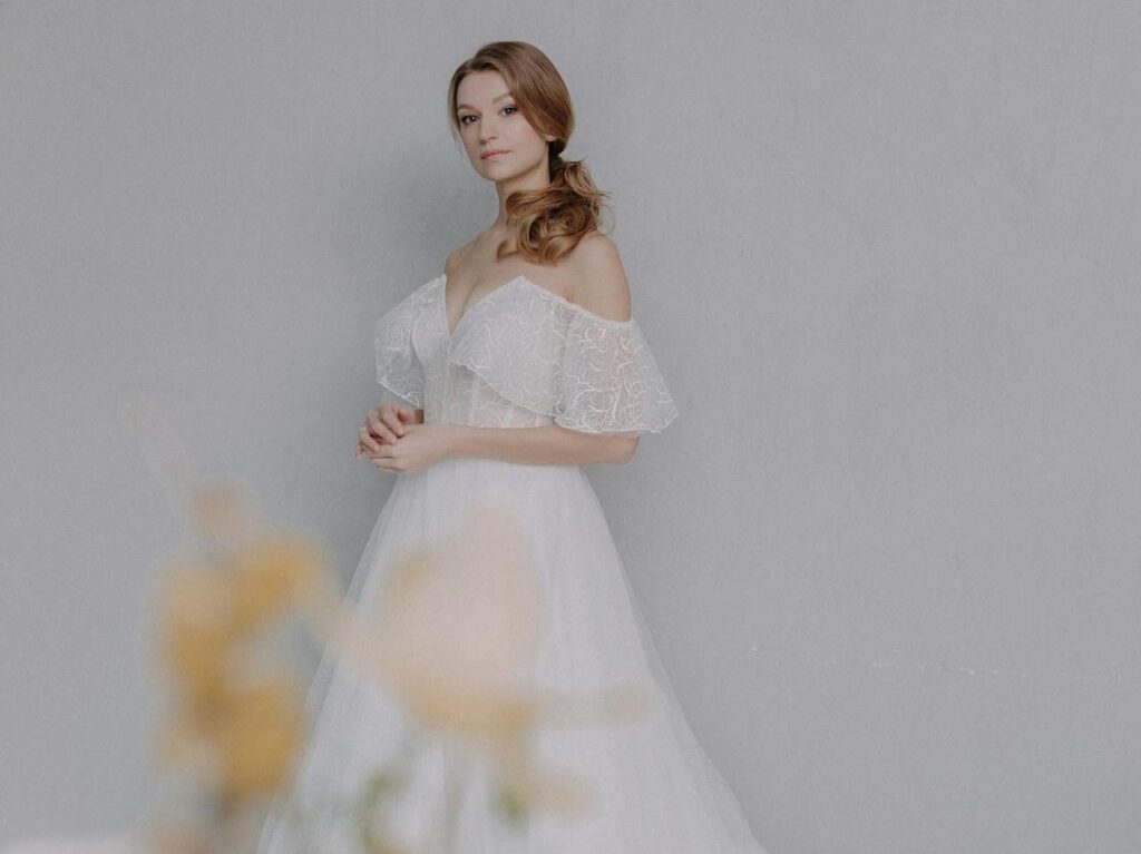 White wedding gown with off the shoulder sleeves, ideal for long slips under maxi dresses in NZ